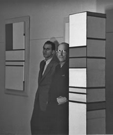 Mondrian with Harry Holtzman, in Holtzman's studio. 1940