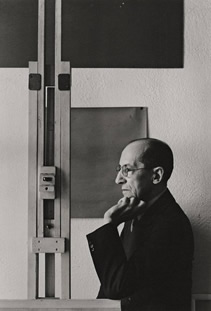 Mondrian in his studio at 353 East 52nd Street Photograph by Arnold Newman, 1941.